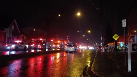 Numerous fire crews gathered to pay tribute while paramedics treat patient Stock Footage 127604459
