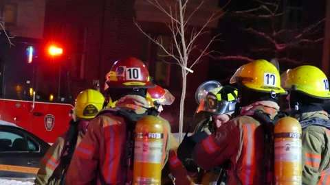 Numerous firefighters making joke at scene Stock Footage 139663890