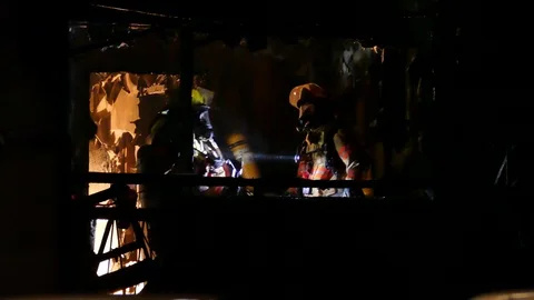 Numerous firefighters at night Stock Footage 120162601
