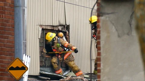 Numerous firefighters working extremly hard Stock Footage 120121930