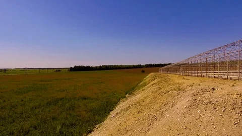 Numerous frames of greenhouses in the field Stock Footage 109374675