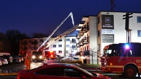 Numerous ladders erected at structure fire Stock Footage 114706769