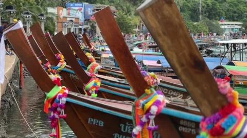 Numerous long-tail boats, anchored in Phi Phi island of Thailand adorned Stock Footage 256206543