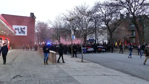 Numerous protesters chanting in the street Stock Footage 114764585