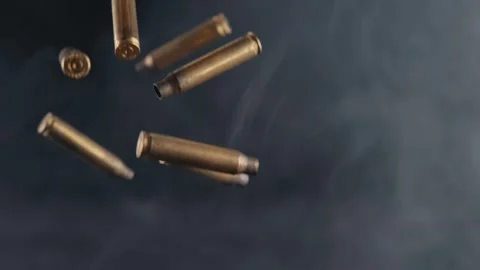 Numerous Spent Ammunition Casings Fallin, Stock Video