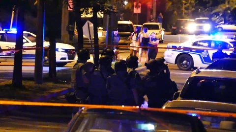 Numerous SWAT agents during standoff Stock Footage 99841982
