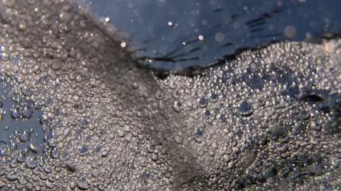 Numerous underwater air bubbles form a dense moving cluster through seawater ben Stock Footage 345225250