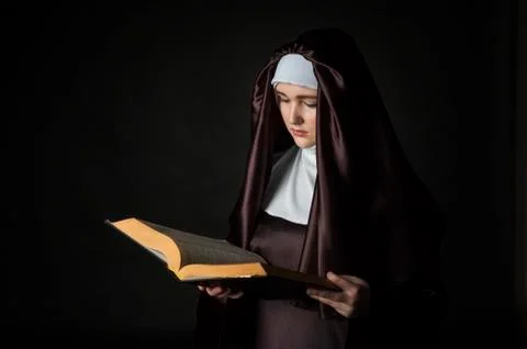 Nun with bible Stock Photos