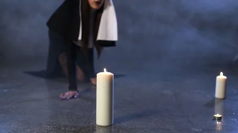 Nun blows out a candle Video stock 96112466