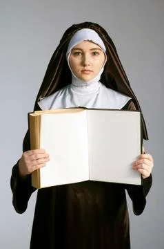 Nun with book Stock Photos