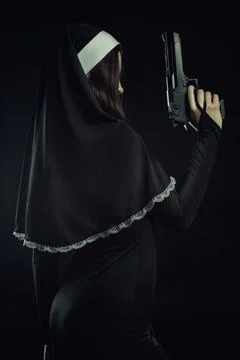 Nun with gun Stock Photos