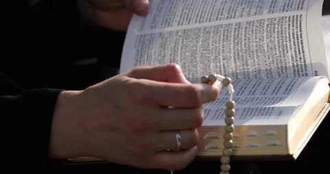The nun sister is flipping through the Scriptures Stock-Footage 140602126