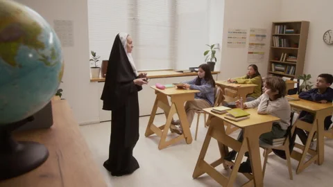 Nun Speaking to Kids in Class Stock Footage 328329254