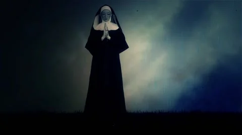 Nun Wearing Veil Standing in a Praying Pose Under Rain and Thunder Storm Stock Footage 59124520