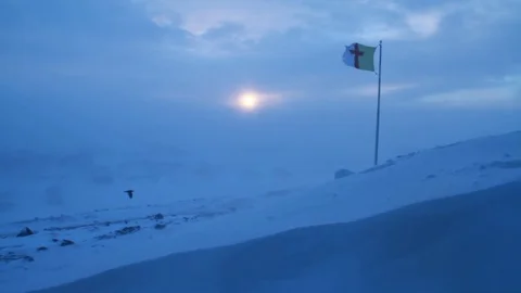 Nunavut flag in the middle of blizzard Video stock 96575743