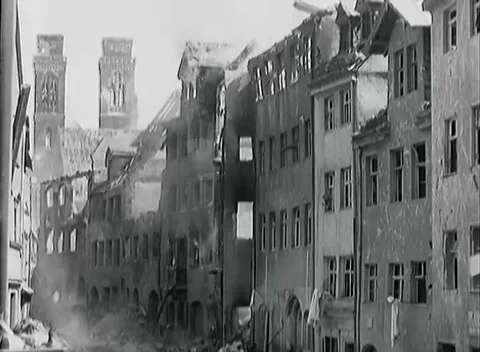 NUREMBERG - 1945: Clearing the city — White cloth hangs from an arcaded facade Video stock 342919663