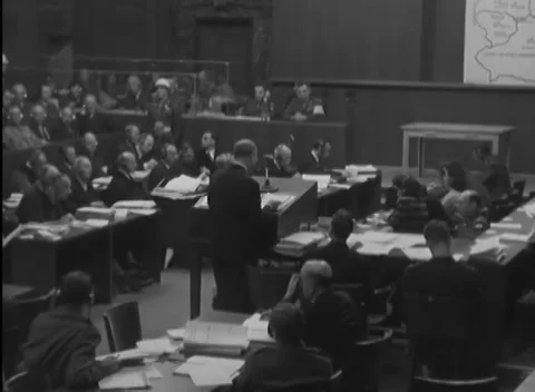 NUREMBERG - 1945: IMT proceedings — Bound typescript at the microphone Stock Footage 343542330