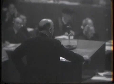 NUREMBERG - 1946: Close rear view at the microphone desk Stock Footage 342921049