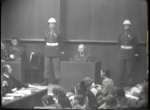 NUREMBERG - 1946: Guards stand apart beside the witness box Stock Footage 342920819
