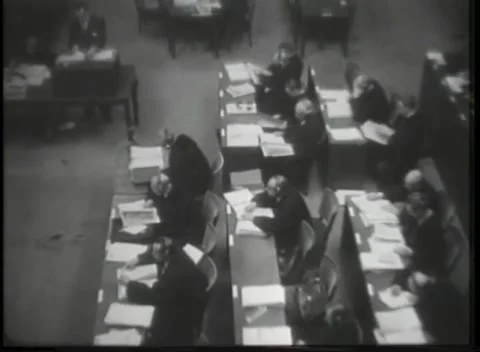 NUREMBERG - 1946: High angle over document-heaped court tables Stockbeeldmateriaal 342921078