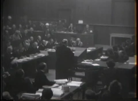 NUREMBERG - 1946: Packed rows fill a war crimes courtroom Stock Footage 342921042