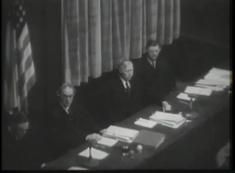 NUREMBERG - 1946: Raised bench under heavy pleated curtains 库存影片 342921159
