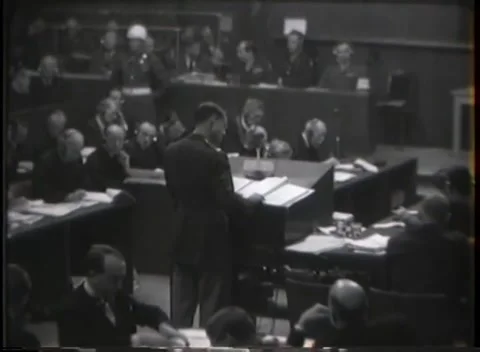 NUREMBERG - 1946: Reading stand with tribunal bench beyond Stock Footage 342920988