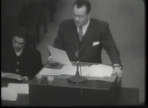 NUREMBERG - 1946: A single sheet held up at the microphone Stock Footage 342921083