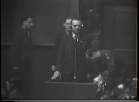 NUREMBERG - 1946: War crimes hearing — Stout witness with headphones Stock-Footage 343320804