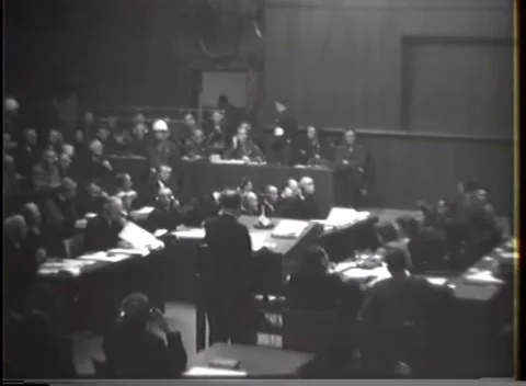 NUREMBERG - 1946: War crimes hearing — Pan from tables to witness box Video stock 343320805