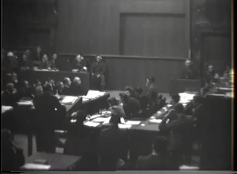 NUREMBERG - 1946: War crimes hearing — Uniformed man on open court floor Vídeos de archivo 343320822
