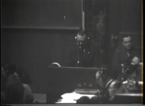 NUREMBERG - 1946: War crimes hearing — Doorway and tiered dock from above 動画素材 343320830