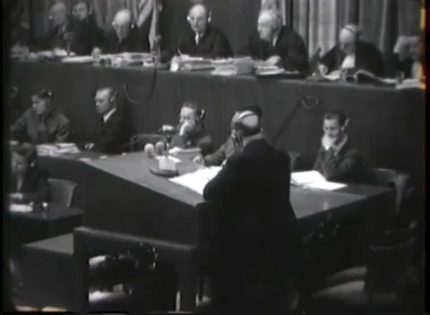 NUREMBERG - 1946: War crimes hearing — Bench above long court table 動画素材 343320847