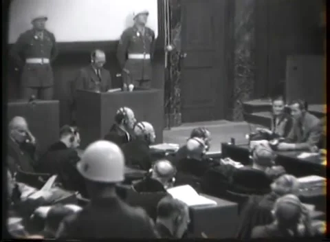 NUREMBERG - 1946: War crimes hearing — Document held at distant box Stockbeeldmateriaal 343320864