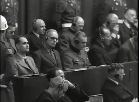 NUREMBERG - 1946: War Crimes Trials — Guard posted at the dock rail Stock Footage 342818804