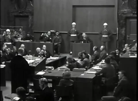NUREMBERG - 1946: War Crimes Trials — Gowned counsel addresses court Stock Footage 342818873