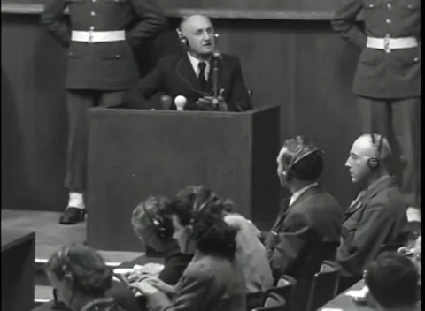 NUREMBERG - 1946: War Crimes Trials — Streicher above the interpreters Stock Footage 342818907