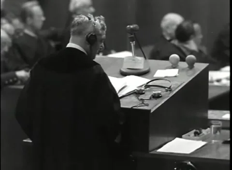 NUREMBERG - 1946: War Crimes Trials — Robed man at the lectern Vídeo Stock 342818933