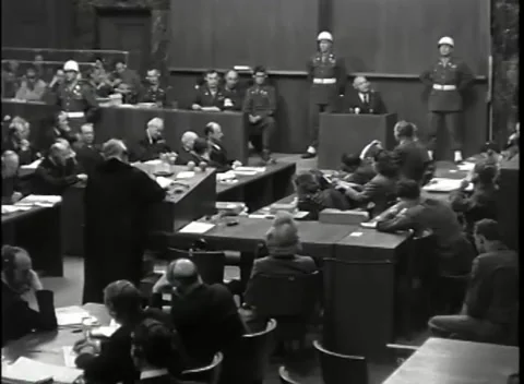 NUREMBERG - 1946: War Crimes Trials — High wide of the full courtroom Stock Footage 342818941