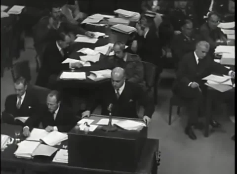 NUREMBERG - 1946: War Crimes Trials — Officer reading behind the desk Видео 342819346