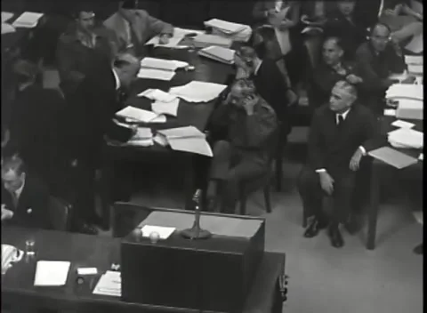 NUREMBERG - 1946: War Crimes Trials — Papers boxed at the empty desk Stock Footage 342819348
