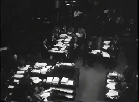 NUREMBERG - 1946: War Crimes Trials — Evidence papers pile the counsel tables Stock Footage 342919340