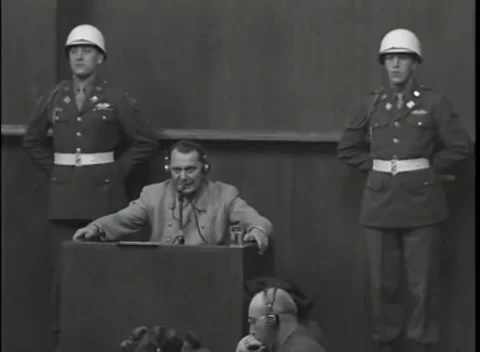 NUREMBERG - 1946: War Crimes Trials — Tight framing on Hermann Göring at the box Stock Footage 342919736