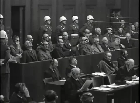 NUREMBERG - 1946: War Crimes Trials — White-helmeted guards behind the dock Stock Footage 342919833