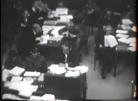 NUREMBERG - 1946: War Crimes Trials — Document files stacked on counsel tables Stock Footage 342919984