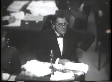NUREMBERG - 1946: War Crimes Trials — Counsel upright at the courtroom Видео 342919993