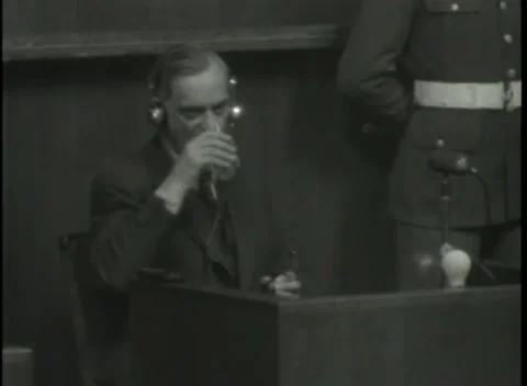 NUREMBERG - 1946: War Crimes Trials — A drink of water at the witness box Stock Footage 342920092