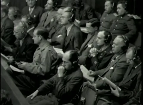 NUREMBERG - 1946: War Crimes Trials — Front rows of the gallery in headsets Stock Footage 342920113