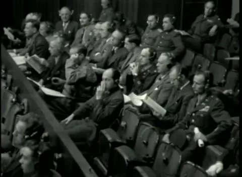 NUREMBERG - 1946: War Crimes Trials — Elevated wide over the raked gallery Stock Footage 342920119