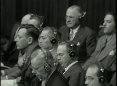NUREMBERG - 1946: War Crimes Trials — Rows of listeners in translation headsets Stock Footage 342920144